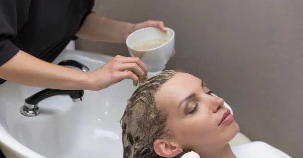 Woman getting hair masks treatment