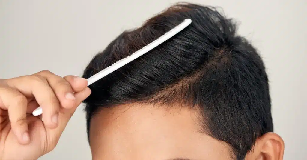 man combing his hair