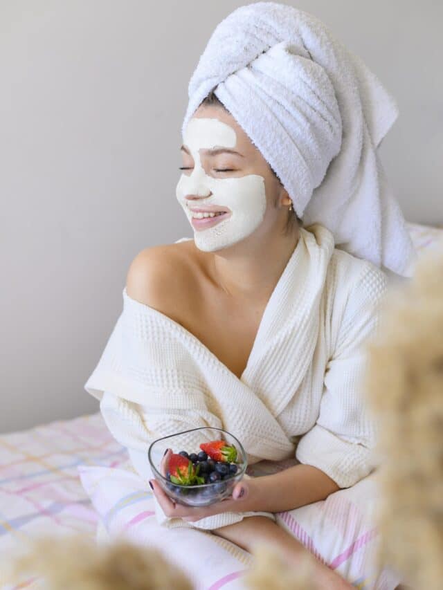 happy-woman-wearing-towel-head-face-mask
